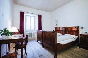 Ένα ή περισσότερα κρεβάτια σε δωμάτιο στο Historic Hotel Albrici