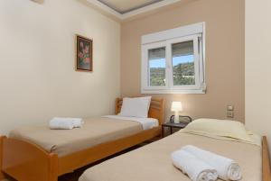 Postel nebo postele na pokoji v ubytování Beach Front Condo South Crete