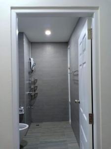 a bathroom with a shower stall and a toilet at TEAK VILLA in Bangna +35 photos