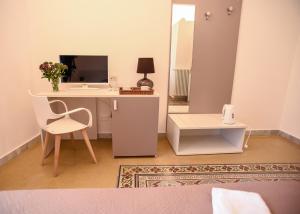 Televízia a/alebo spoločenská miestnosť v ubytovaní Rooms 19 B&B