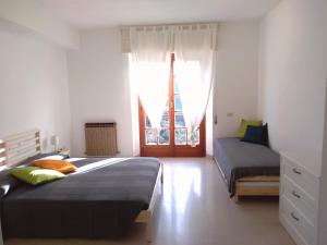 a bedroom with two beds and a view of the eiffel tower at ROMANTICA TOSCANA in Scarlino
