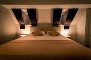 מיטה או מיטות בחדר ב-VillaluX