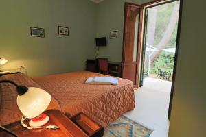 
a bedroom with a bed and a window at Dimora Relais Excelsa in Gallipoli
