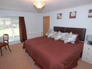 En eller flere senge i et værelse på Garden View