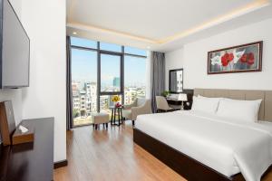 Rúm í herbergi á Golden Line Hotel Danang
