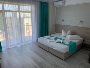Un pat sau paturi într-o cameră la Vila Elva