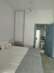 Postel nebo postele na pokoji v ubytování MELI-IOS
