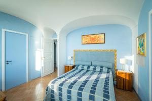 Postel nebo postele na pokoji v ubytování Borgo dei Saraceni - Domus Indomita
