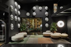a lobby with stools and skulls on the wall at Ohla Barcelona in Barcelona
