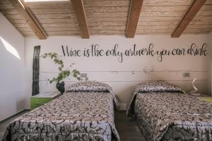Un pat sau paturi într-o cameră la Ca' Colomba
