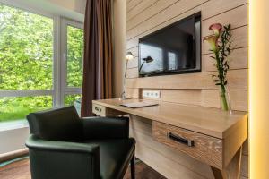 TV a/nebo společenská místnost v ubytování Hotel Der Seehof