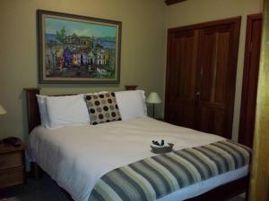 Voodi või voodid majutusasutuse The Palms Oceanfront Suites toas