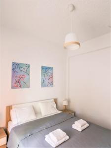 Ένα ή περισσότερα κρεβάτια σε δωμάτιο στο Beachfront deluxe apt. +18 φωτογραφίες