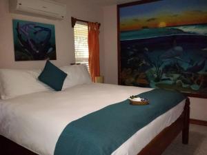 Voodi või voodid majutusasutuse The Palms Oceanfront Suites toas
