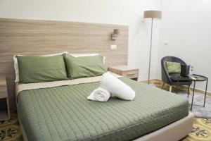 Giường trong phòng chung tại Albergo D'Onofrio