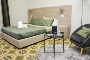 Postel nebo postele na pokoji v ubytování Albergo D'Onofrio