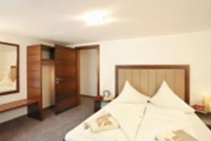 Postel nebo postele na pokoji v ubytování Ischgl Suite