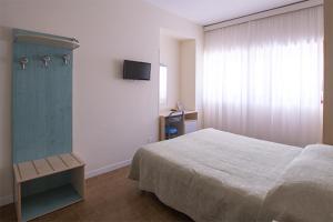 Rúm í herbergi á Hotel Scacciapensieri