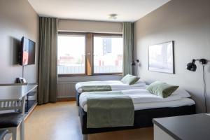 Postel nebo postele na pokoji v ubytování Hotel B&B Gränden