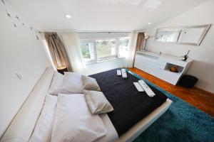 Posteľ alebo postele v izbe v ubytovaní Magic Blue Sky Apartment