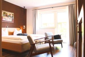 Postel nebo postele na pokoji v ubytování WeinHotel Fritz Walter
