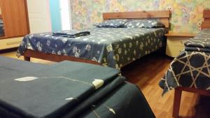 Кровать или кровати в номере Mini-Hotel Mazda Club on Dunayskaya 1A