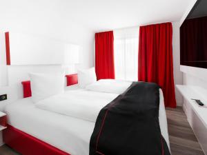 Ένα ή περισσότερα κρεβάτια σε δωμάτιο στο Hotel Andante Rust