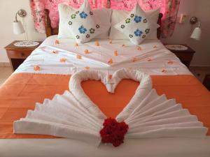 Кровать или кровати в номере Pension Hibiscus