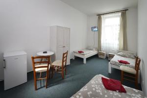 Postel nebo postele na pokoji v ubytování Penzion Pivovar Podlesí + 28 fotografií