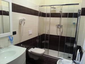 Koupelna v ubytování Hotel Paradiso