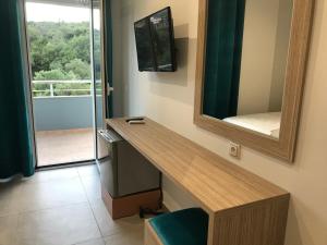 TV a/nebo společenská místnost v ubytování VIAL Rooms