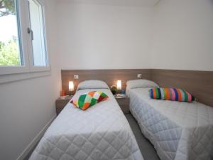 A bed or beds in a room at Residenza Due Perle