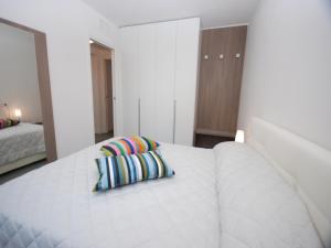 A bed or beds in a room at Residenza Due Perle