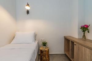 A bed or beds in a room at Livikon by the Sea