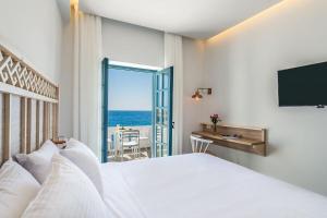 A bed or beds in a room at Livikon by the Sea