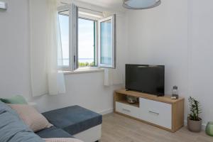 Телевизор и/или развлекательный центр в Apartments Silvana