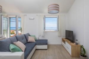 Телевизор и/или развлекательный центр в Apartments Silvana