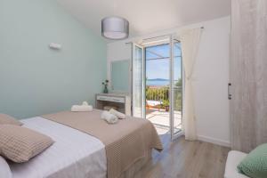Кровать или кровати в номере Apartments Silvana