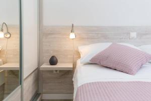 Кровать или кровати в номере Apartments Silvana