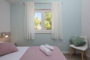 Кровать или кровати в номере Apartments Silvana