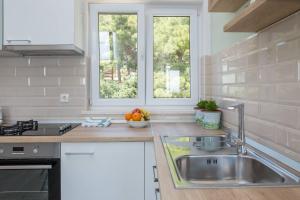 Кухня или мини-кухня в Apartments Silvana
