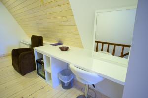 a bathroom with a sink, toilet and a mirror at Hotel Polar Star in Žabljak