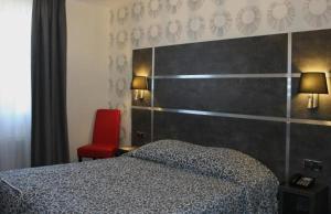 Postel nebo postele na pokoji v ubytování Hostellerie St Vincent