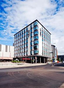 a large building on the corner of a street at GLO Hotel Sello in Espoo