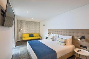 Letto o letti in una camera di Allegro Madeira - Adults Only