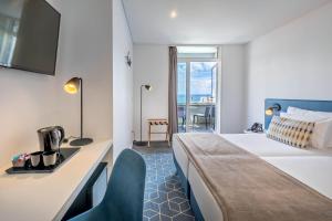 Letto o letti in una camera di Allegro Madeira - Adults Only