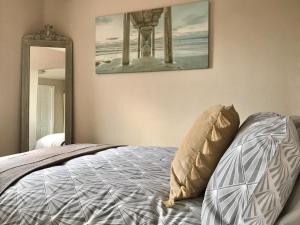 a bedroom with a bed and a mirror at Northorpe in Hornsea