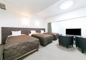 Cama o camas de una habitación en Pearl Hotel Kayabacho