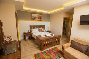 Postel nebo postele na pokoji v ubytování The PeraPort Hotel