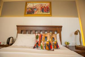 Postel nebo postele na pokoji v ubytování The PeraPort Hotel